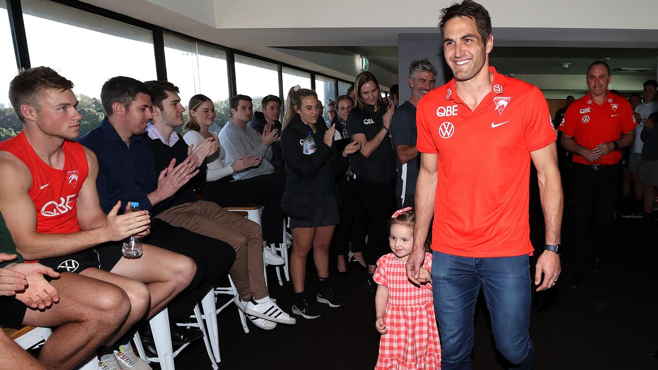 Sydney Swans great Josh Kennedy walks into his retirement press conference with daughter Isabella on Tuesday. Picture: Phil Hillyard