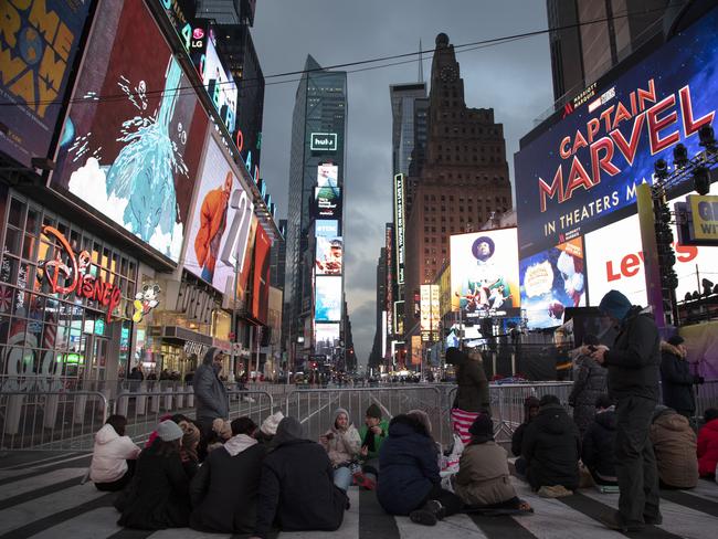 People begin to gather in New York's Times Square in anticipation of the New Year's celebration. Picture: AP