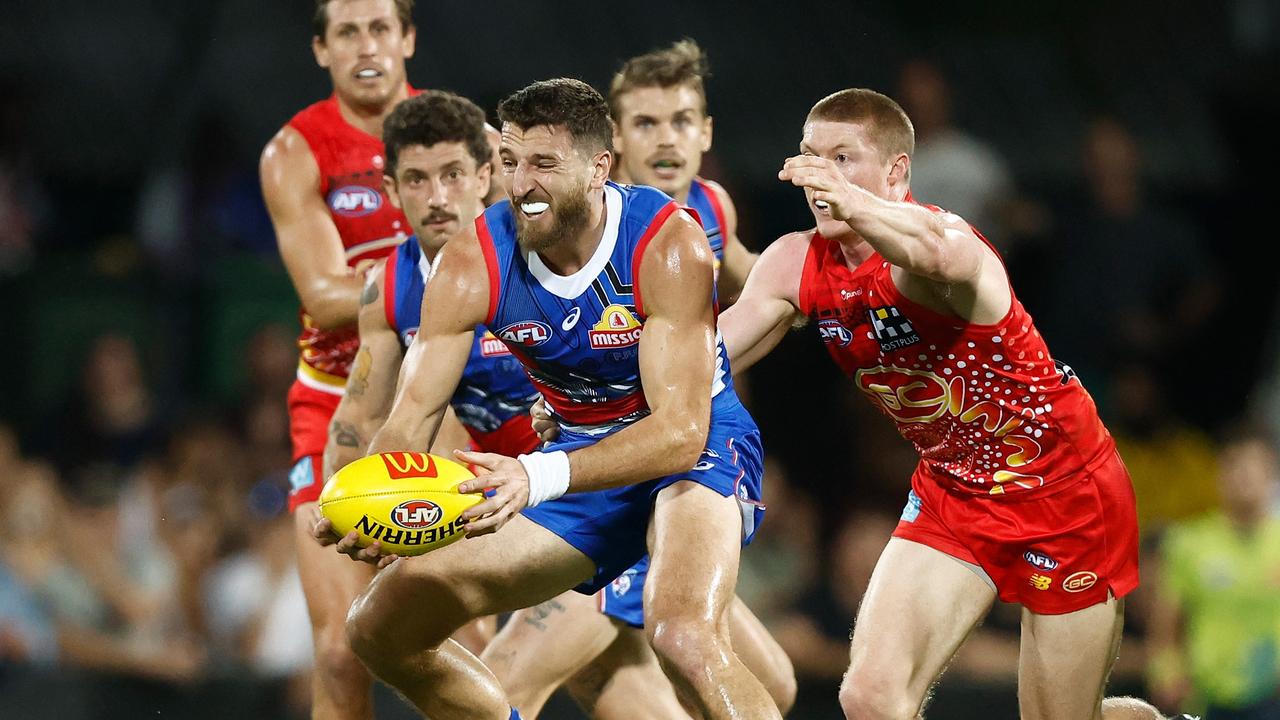 Marcus Bontempelli of the Bulldogs is tackled by Matt Rowell of the Suns during the 2023 AFL Round 11 match between the Gold Coast Suns and the Western Bulldogs at TIO Stadium. (Photo by Michael Willson/AFL Photos via Getty Images)