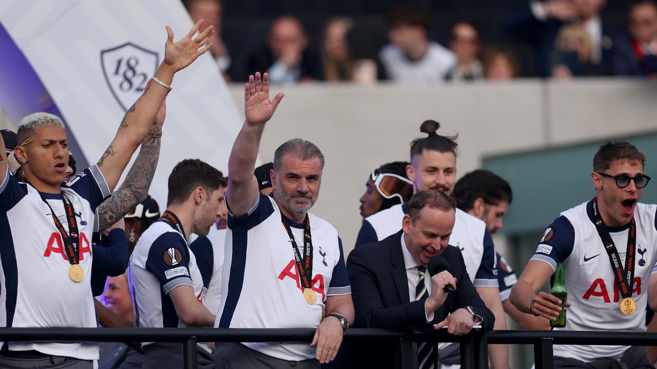 Manager Ange Postecoglou waves to the fans from the victory buss. Picture: Harry Murphy / Getty Images