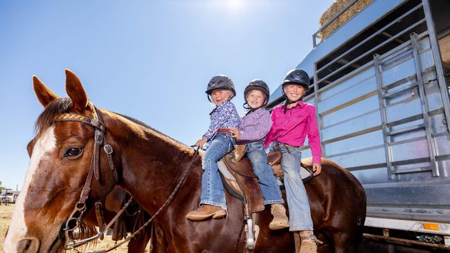 Mount Isa Rodeo 2024 - The Willoughby sisters from left, Daisy, 4, Ruby, 6, and Lottie travelled from South Australia for the Mount Isa Rodeo. Picture by Luke Marsden. - Photo Supplied