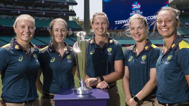 Australian players with the World Cup trophy they hope to win this year.