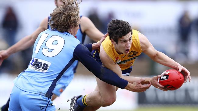 Woodville-West Torrens’ Jake Comitogianni gets himself out of trouble against Sturt’s Thomas Harms.