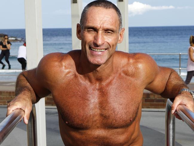 Bondi icon Dimitri Moskovich who was famously photographed by Kristi Miller on Saturday lodging his vote at Bondi Beach while wearing nothing but a pair of bright red speedos.