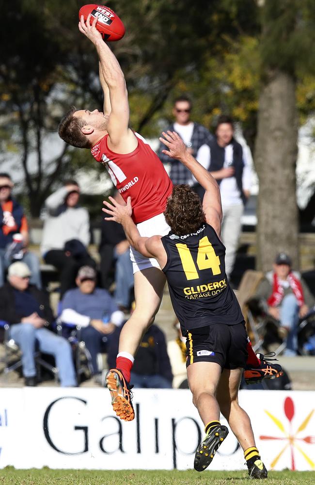 North Adelaide’s Jay Shannon marks against Glenelg’s Jack Haarsma. Picture: SARAH REED