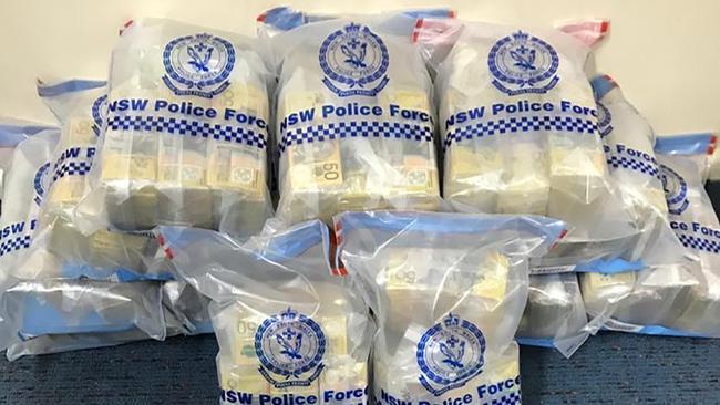 Highway patrol officers from Strike Force Raptor approached a prime mover parked at a service station in rural NSW where they found $2.75m in cash. The 2020 seizure would later be linked to Operation Ironside. Picture: NSW Police