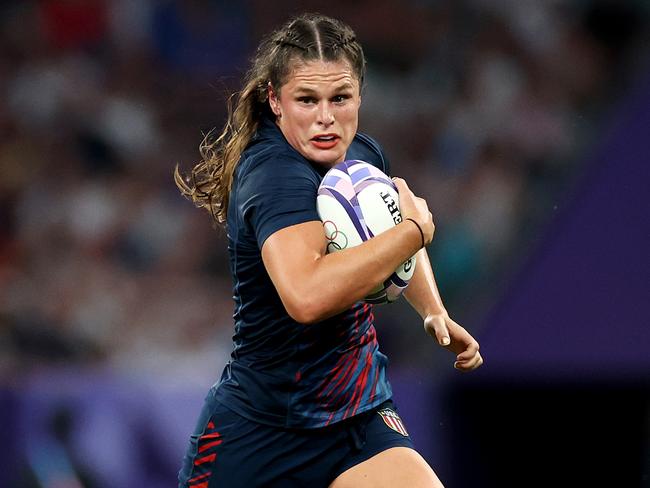 PARIS, FRANCE - JULY 29: Ilona Maher #2 of Team United States runs with the ball during the Women's Rugby Sevens Quarter Final match between Team Great Britain and Team United States on day three of the Olympic Games Paris 2024 at Stade de France on July 29, 2024 in Paris, France. (Photo by Michael Steele/Getty Images)