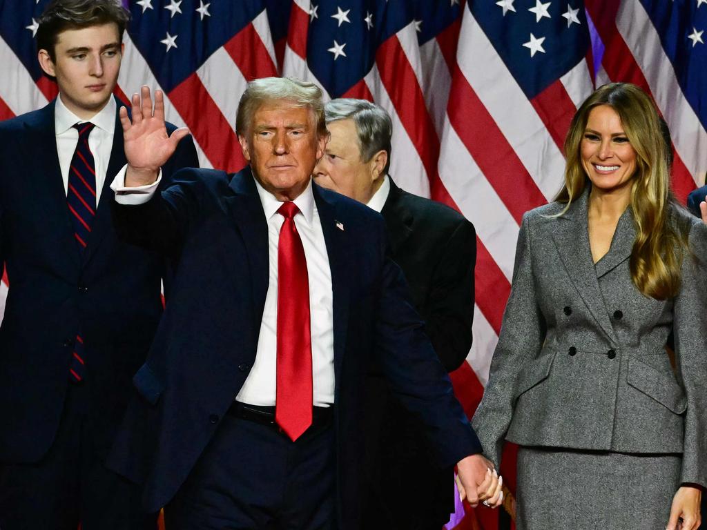 The fact that he towers over his tall father is staggering. Picture: Jim Watson/AFP