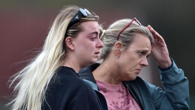 Two women console one another at the scene of the Applegreen service station explosion in Creeslough, Ireland. Picture: Getty Images