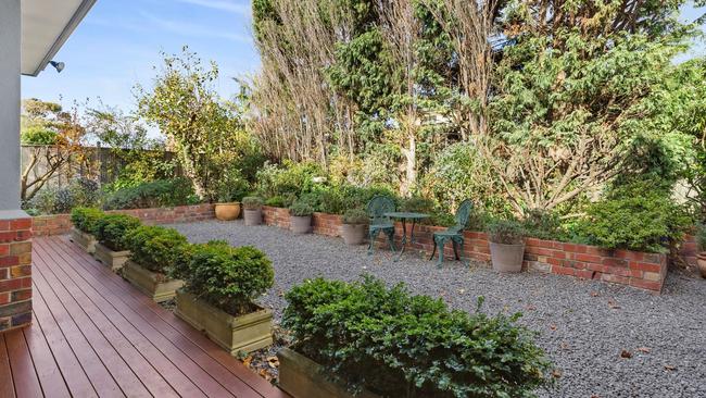 The back deck overlooks a low-maintenance garden.