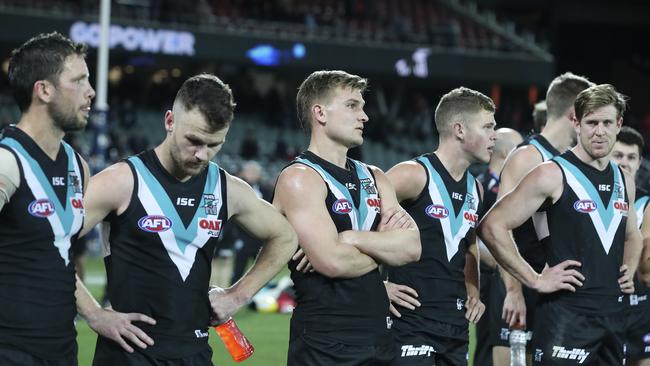 Port players after the loss to Essendon. Picture Sarah Reed