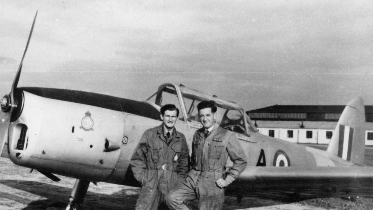 Bob Hawke (left), with his flight instructor, beside a Chipmunk aircraft from the Oxford University Air Squadron.