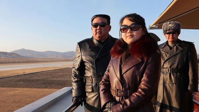 North Korea's leader Kim Jong-un and his daughter observe an air festival during a visit with the 1st Air Force Division Flying Regiment of the Korean People's Army. Picture: KCNA/AFP