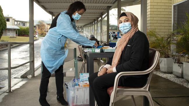 Kavita Singh Care, left, and Rozina Shah are among staff members at Whiddon Aged Care in Glenfield, Sydney, where rapid testing has been introduced. Picture: Chris Pavlich