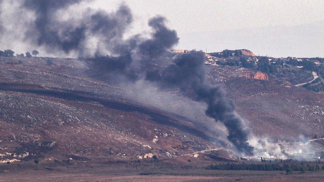 TOPSHOT - Smoke billows from the sites of an Israeli airstrike in Lebanon's southern plain of Marjeyoun along the border with Israel on September 24, 2024. Israel announced dozens of new air strikes on Hezbollah strongholds in Lebanon, a day after 558 people, including 50 children, were killed in the deadliest day of violence since the Lebanese civil war. (Photo by RABIH DAHER / AFP)