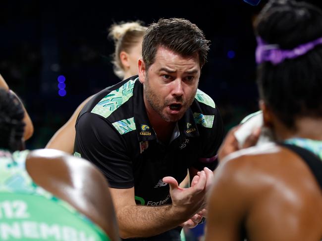 PERTH, AUSTRALIA - JULY 21: Dan Ryan, Coach of the Fever talks to the players at the 3rd quarter time break during the Super Netball Minor Semi Final match between West Coast Fever and Sunshine Coast Lightning at RAC Arena, on July 21, 2024, in Perth, Australia. (Photo by James Worsfold/Getty Images)