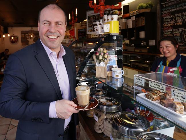 Federal Treasurer Josh Frydenberg gets a coffee from shop owner Winnie Xu in Camberwell, Victoria. Picture: Nicole Cleary