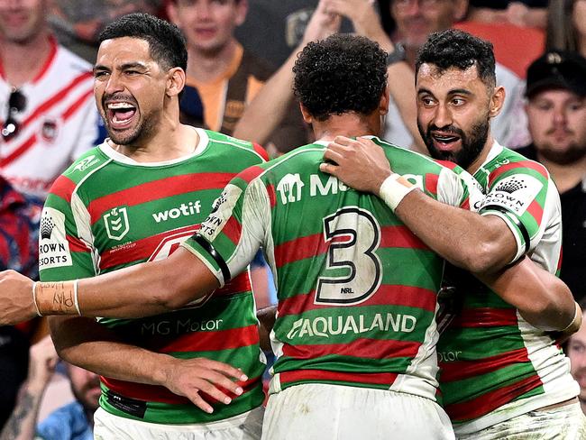 BRISBANE, AUSTRALIA - MAY 06: Alex Johnston of the Rabbitohs celebrates with team mates Cody Walker and Isaiah Tass of the Rabbitohs after scoring a try during the round 10 NRL match between Melbourne Storm and South Sydney Rabbitohs at Suncorp Stadium on May 06, 2023 in Brisbane, Australia. (Photo by Bradley Kanaris/Getty Images)