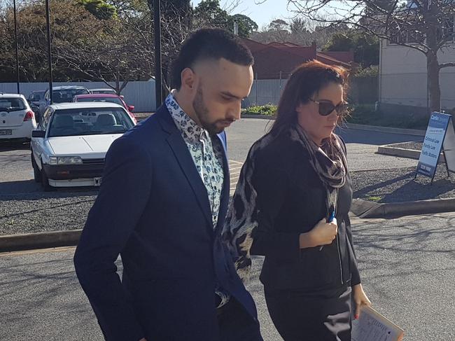 Clarence Yates, left, outside the Christies Beach Magistrates Court with his lawyer, Stacey Carter. He is accused of vandalism and spitting on a police officer. Picture: Sean Fewster.