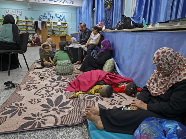 Palestinian families take shelter in a UN school in Gaza City after fleeing their homes. Picture: Mahmud hams / AFP