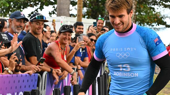 Australia's Jack Robinson walks to the podium after taking the silver in the men's surfing, during the Paris 2024 Olympic Games, in Teahupo'o, on the French Polynesian Island of Tahiti, on August 5, 2024. (Photo by Jerome BROUILLET / AFP)