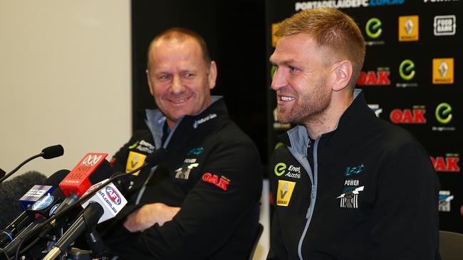 Big fan ... Port coach Ken Hinkley shares a laugh with Kane Cornes as he announces his retirement. Photo Sarah Reed.