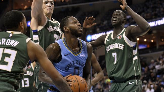 Memphis Grizzlies forward JaMychal Green looks to shoot between Milwaukee Bucks' Sterling Brown (23), Ersan Ilyasova (77) and Thon Maker (7).