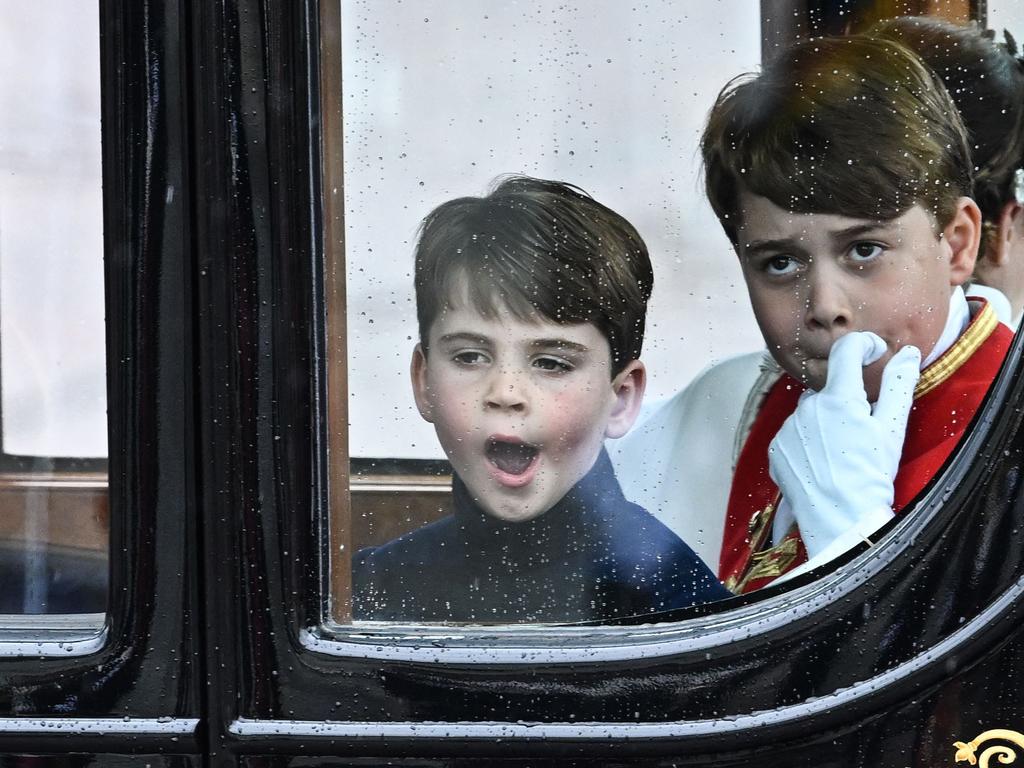 Prince Louis and Prince George travel back to Buckingham Palace from Westminster Abbey. Picture: AFP