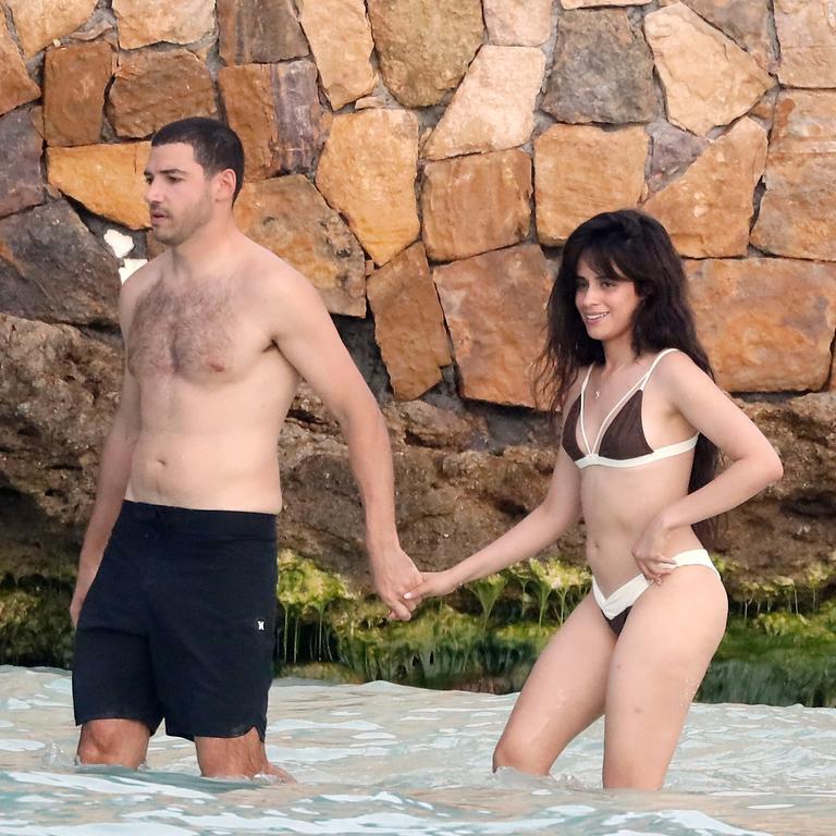 Camila and her new man walk hand-in-hand … Picture: Spread Pictures/MEGA