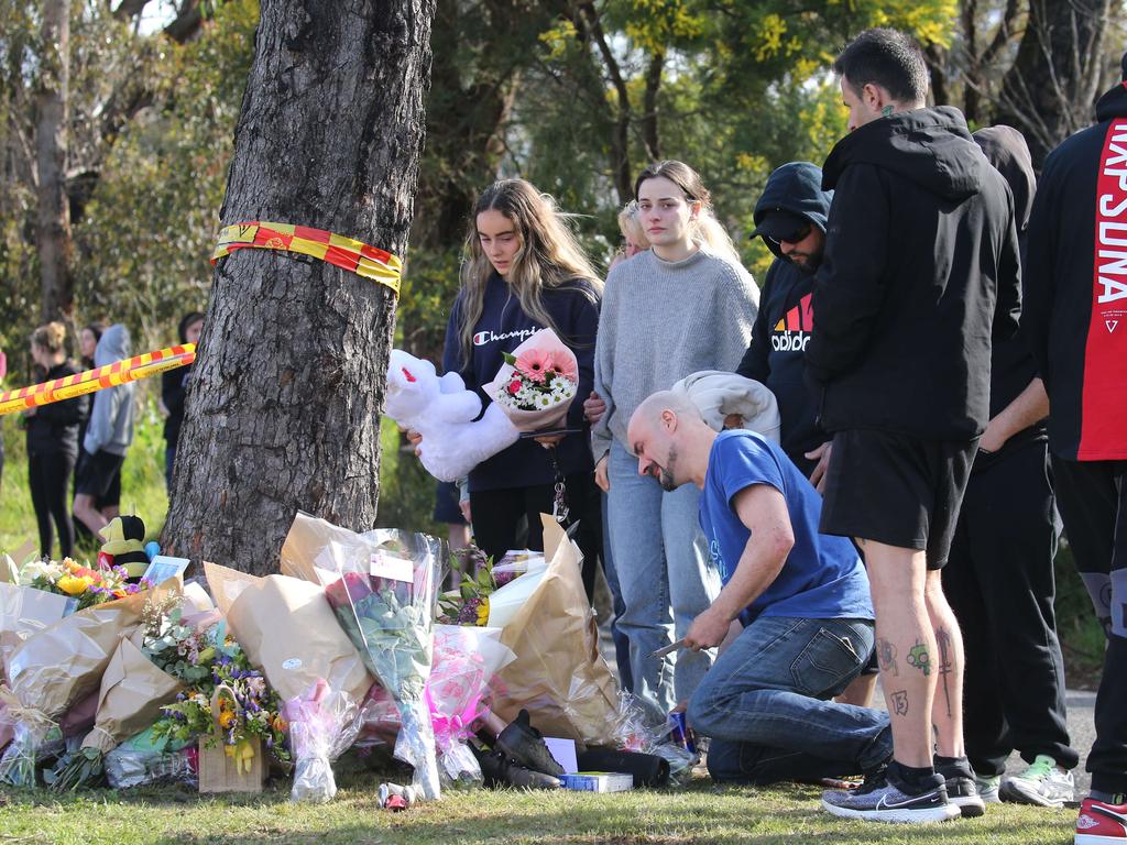 Families were in mourning at the site. Picture: John Feder/The Australian