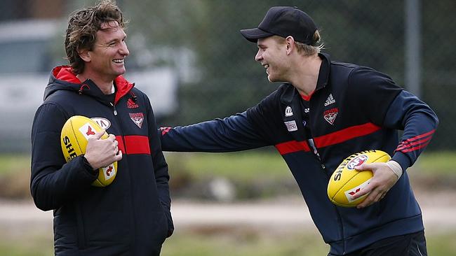 Michael Hurley shares a laugh with James Hird. Picture: Wayne Ludbey