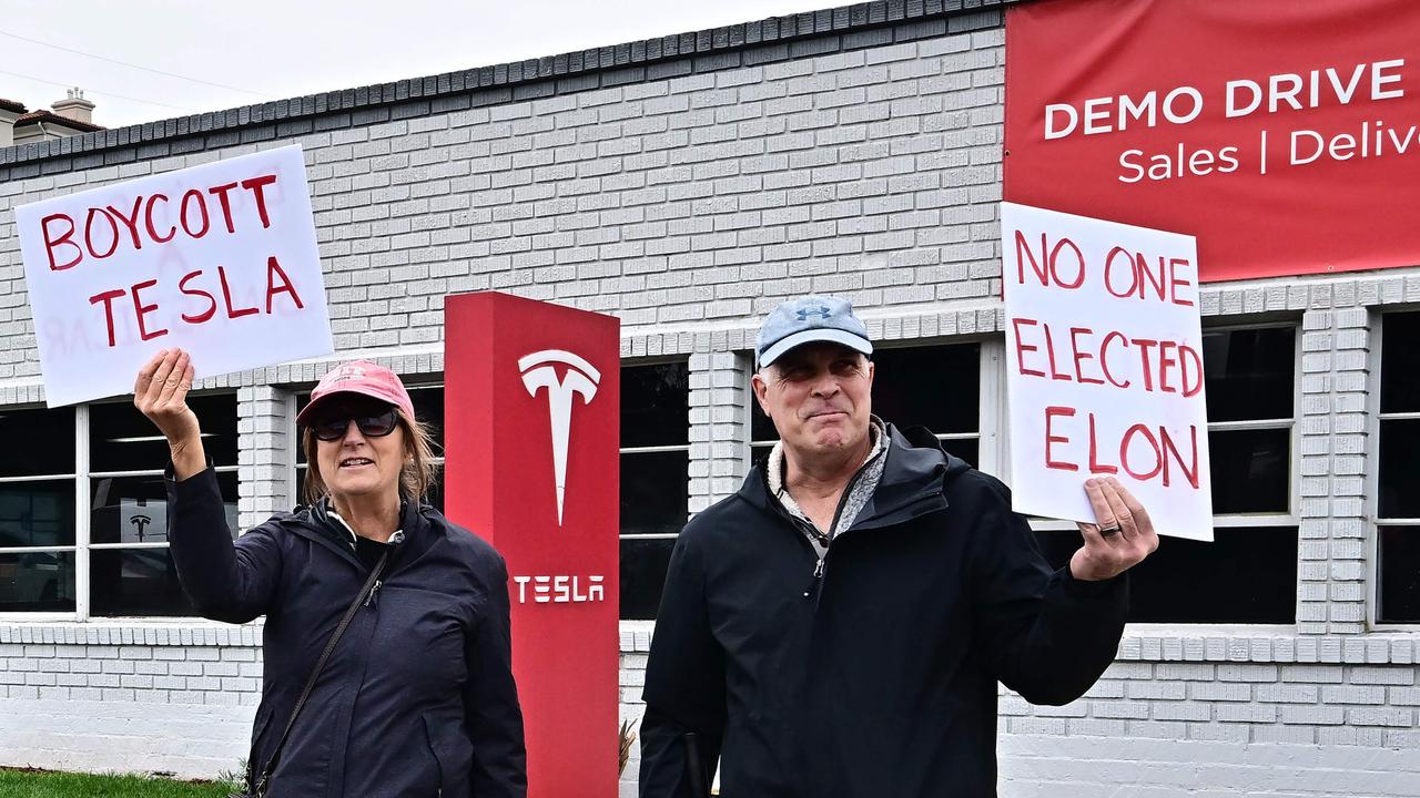 <!DOCTYPE html PUBLIC "-//W3C//DTD HTML 4.0 Transitional//EN" "http://www.w3.org/TR/REC-html40/loose.dtd"><html><body><p>Anti Tesla activists hold signs reading &acirc;&#128;&#152;No One Elected Elon&acirc;&#128;&#153; at a Los Angeles dealership. Picture: Frederic J. Brown/AFP</p></body></html>