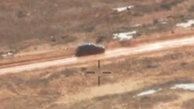 A car bogged on a rain soaked road near Oodnadatta where four people were left stranded – including a six-year-old boy. Picture: AMSA