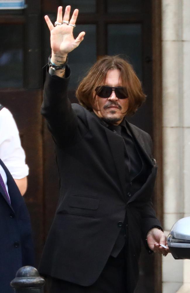 Johnny Depp, pictured waving at supporters outside London’s High Court. Picture: Getty Images