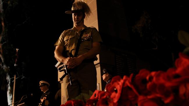 Dawn Service at Parramatta's Prince Alfred Park. A member of the Cataflaque party stands perfectly still alongside the cenotaph.