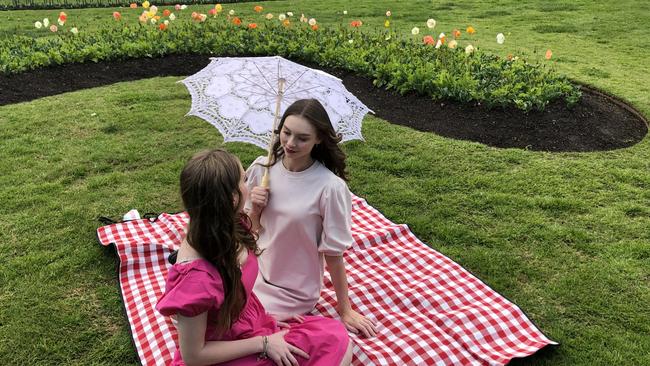 Leonie Ferguson (right), 23, and her friend Georgia Skinner, 21, were at Rosalind Park bright and early to see the opening of Bloom Festival in Bendigo admire the vibrant flowers. Photo: Julieanne Strachan