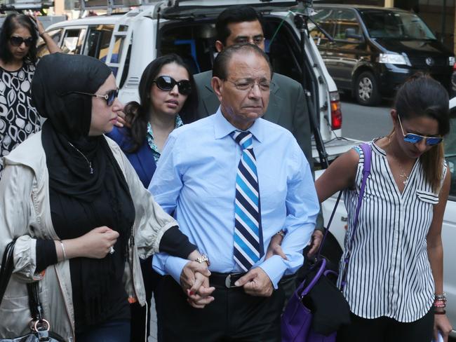 Dr Khalid Qidwai with his children after the sentencing of Tony Halloun convicted of murdering his wife Shahnaz Qidwai. Picture Ross Schultz