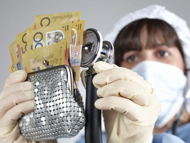 Generic of a doctor conducting a health check on money (a number of $50 notes).