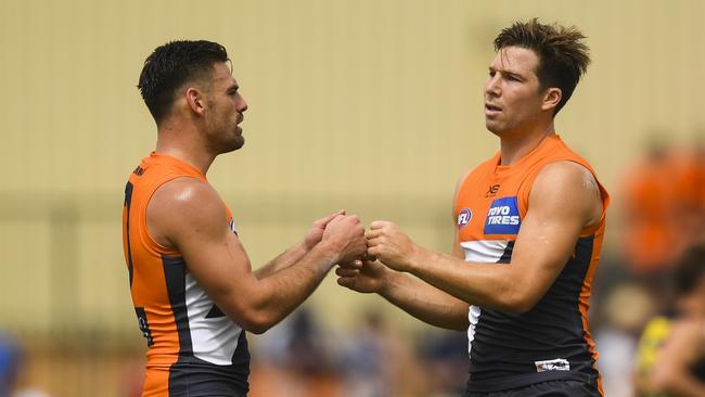 Toby Greene of the Giants (right) celebrates with Stephen Coniglio of the Giants after scoring a goal during the AFL Marsh Community Series pre-season match between the GWA Giants and the Richmond Tigers at Robertson Oval in Wagga Wagga, Sunday, March 8, 2020. (AAP Image/Lukas Coch) NO ARCHIVING, EDITORIAL USE ONLY