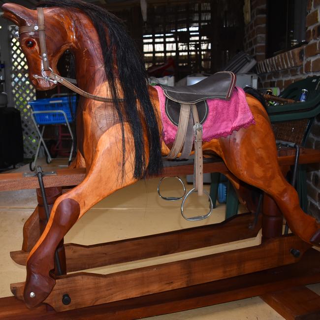 Neil Stuart makes rocking horses and wooden cars at his home in Evans Head