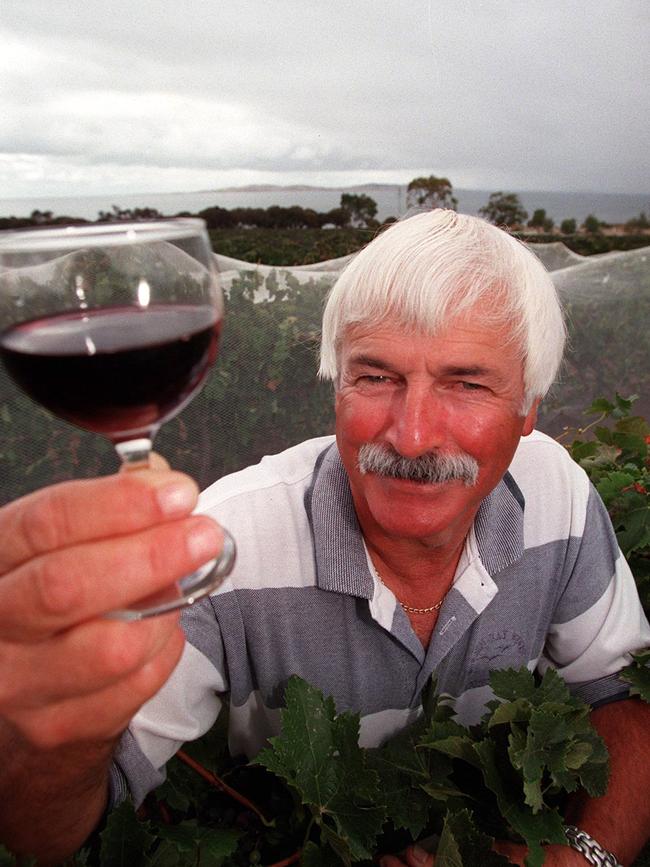 Boston Bay Wines winemaker Graham Ford, pictured in 2008, holding glass of merlot wine.