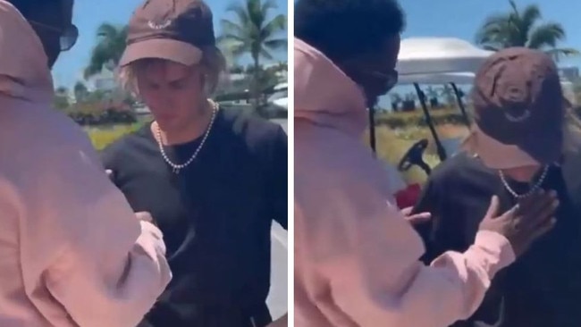 Diddy pats down Justin Bieber seemingly checking for police wires.