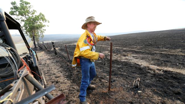 Dick Buckham on his property at Callandah/Terome fixing fences after fighting bushfires for days, near Aratula, on Monday 11th November 2019. Picture: Steve Pohlner