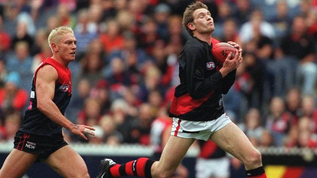 James Hird marks in front of Shane Woewodin in a duel to remember at the MCG in 2001.