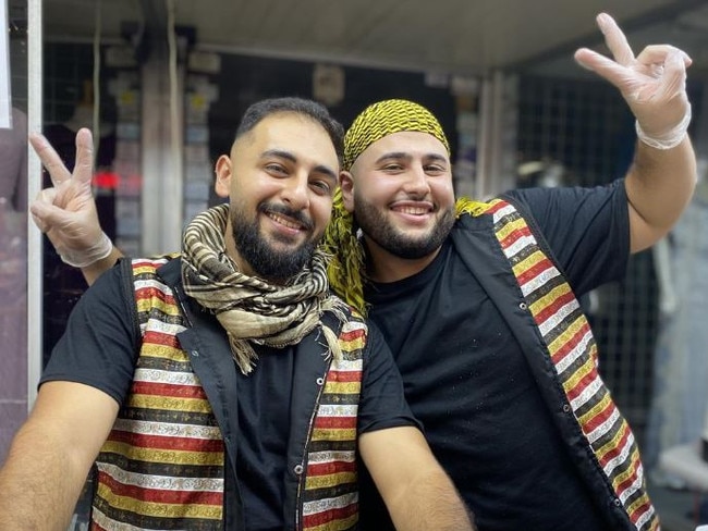 Tarak Alawad (left) and a friend working their knafeh stall at Ramadan Night Markets. Picture: Kirsten Jelinek