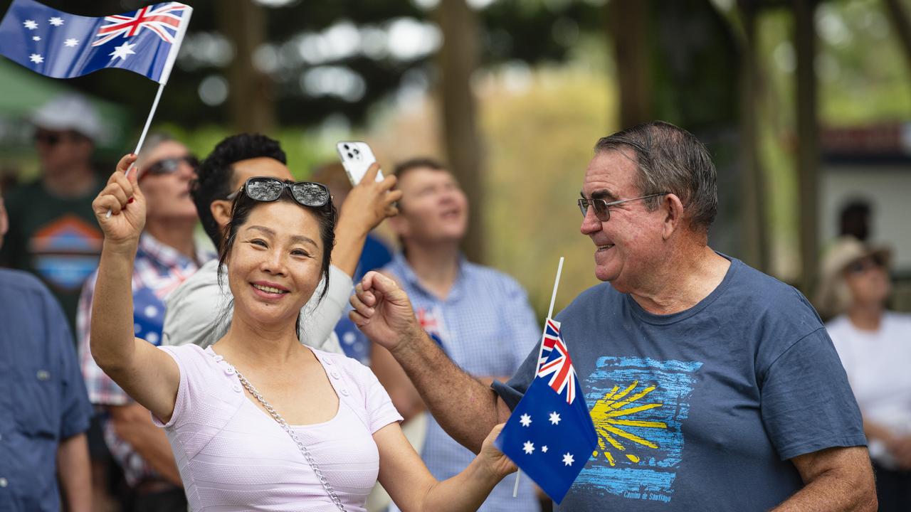 Joanne Liang and Stephen Kelly as the giant flag is raised at Toowoomba Australia Day celebrations at Picnic Point, Sunday, January 26, 2025. Picture: Kevin Farmer