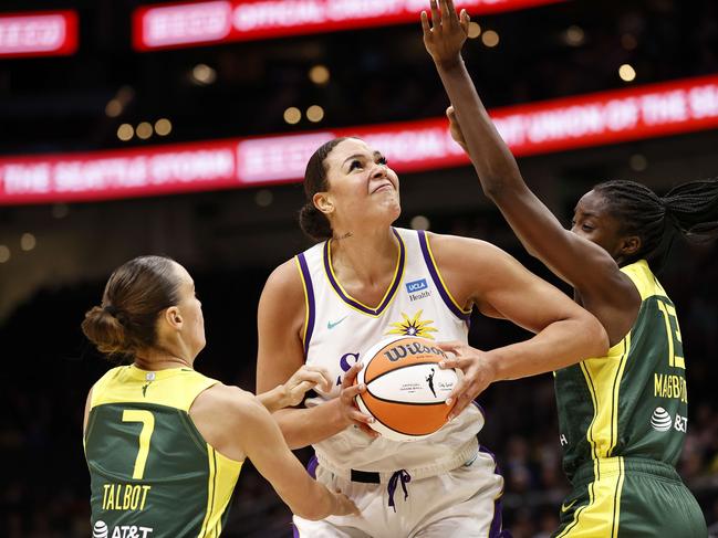 Opals stars Steph Talbot #7 and Ezi Magbegor #13 of the Seattle Storm taking on former Australian teammate Liz Cambage in the WNBA. Picture: Steph Chambers/Getty Images/AFP.