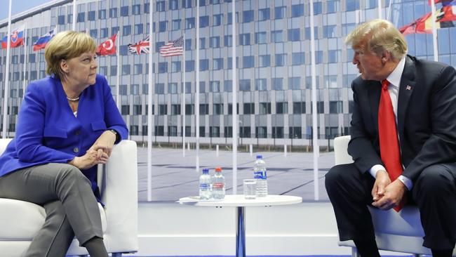 Donald Trump with Angela Merkel during their bilateral meeting in Brussels. Picture; AP.