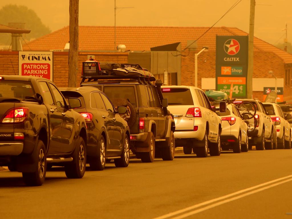 People queue for petrol Merimbula on New Year’s Eve after bushfires cut off the entire south coast of NSW. Stuart McEvoy/The Australian.