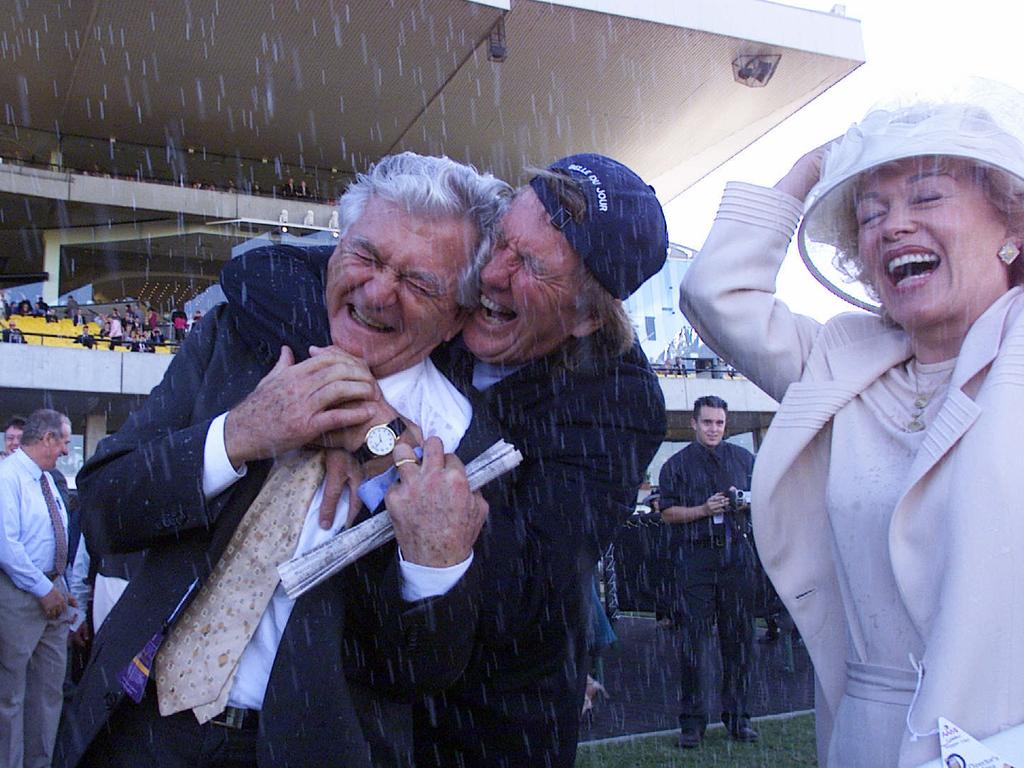 John Singleton with former Austalian Prime Minister Bob Hawke and wife Blanche d'Alpuget celebrating Golden Slipper win of Belle Du Jour at Rosehill 15 April, 2000.